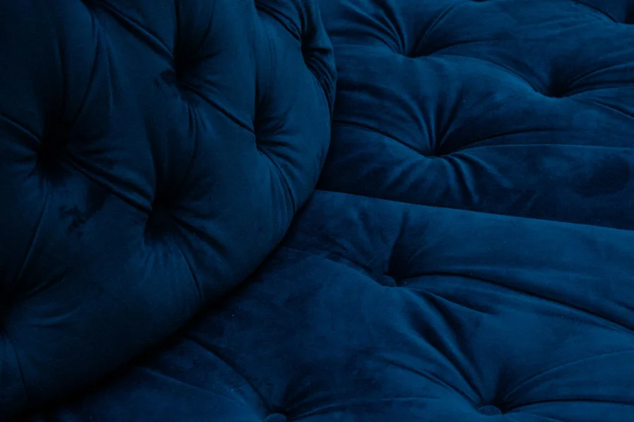 Bea Gold Velvet Sofa Review: Design, Styling, & Care Guide Lustrous Gold Velvet Fabric Texture Close Up